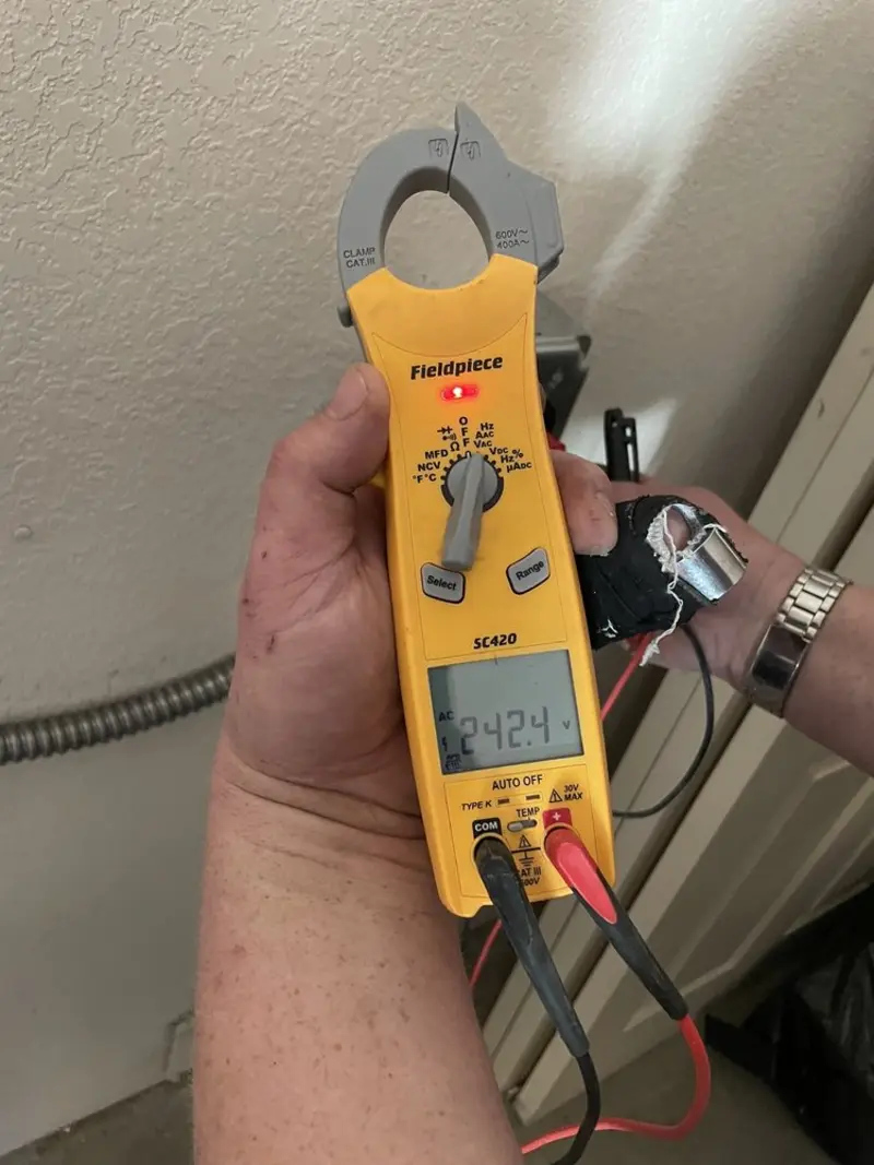 Voltage testing with clamp meter during Whole House Surge Protector in Newton Falls